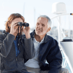 Couple looking through binoculars