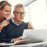 Couple looking at a laptop